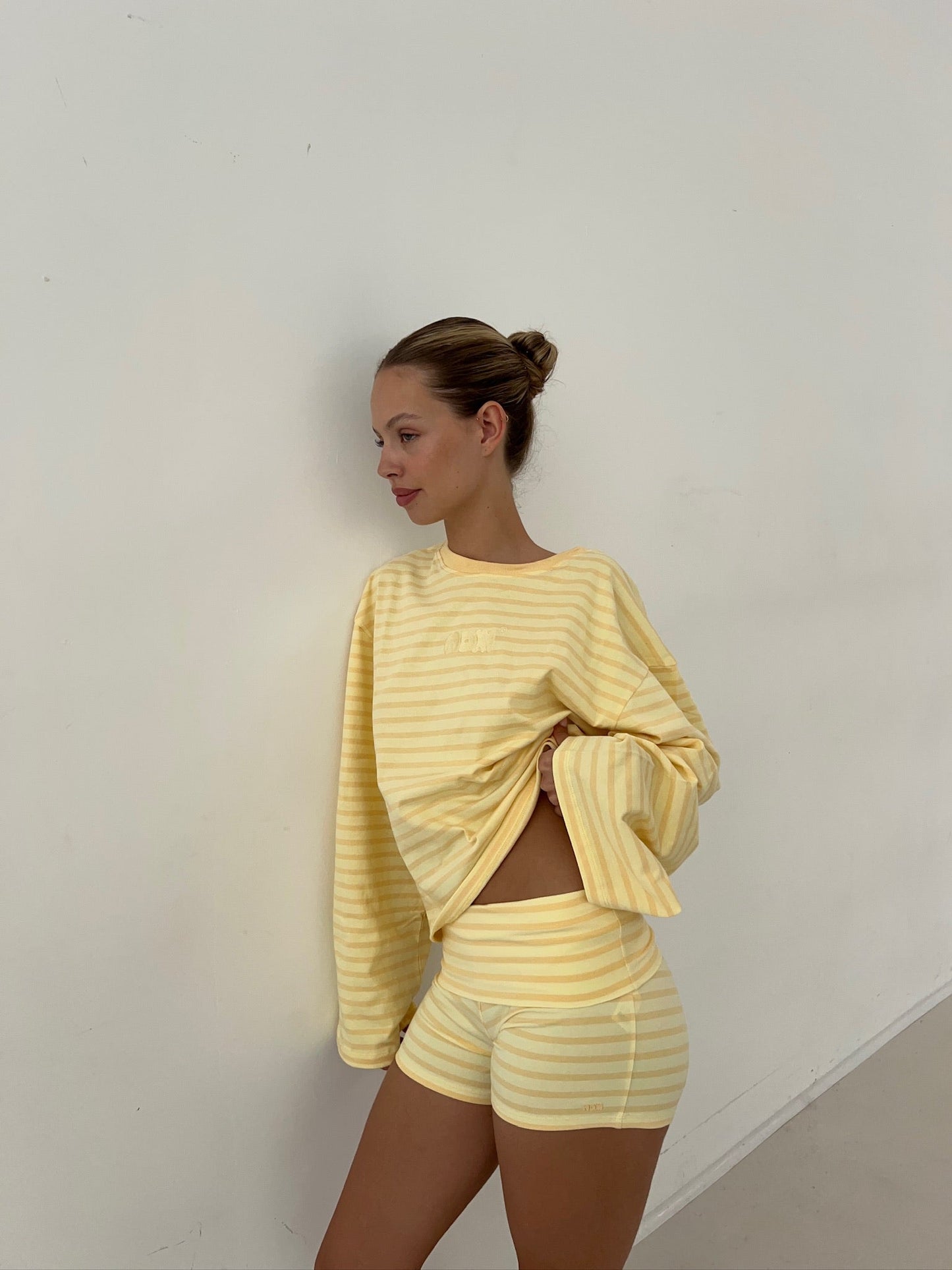 Oversized butter yellow striped long sleeve styled with matching shorts