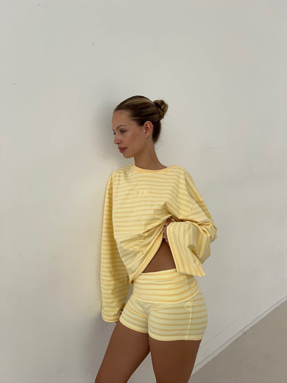 Oversized butter yellow striped long sleeve styled with matching shorts