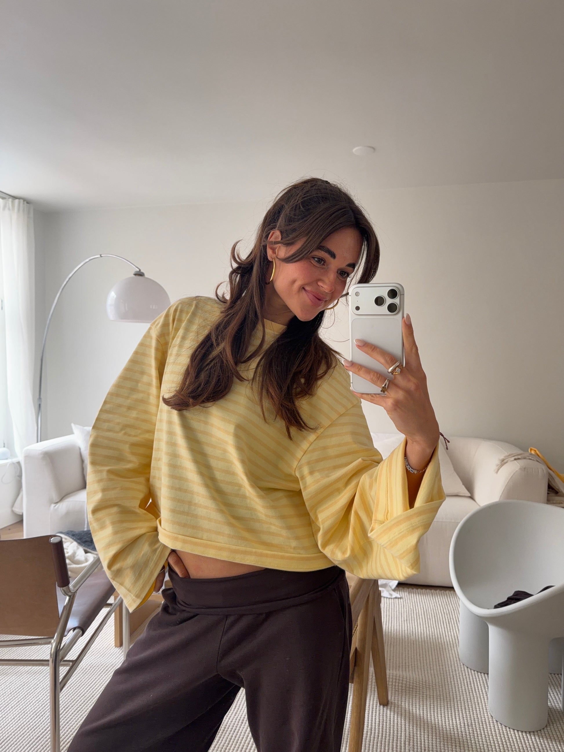 Model wearing oversized butter yellow striped long sleeve