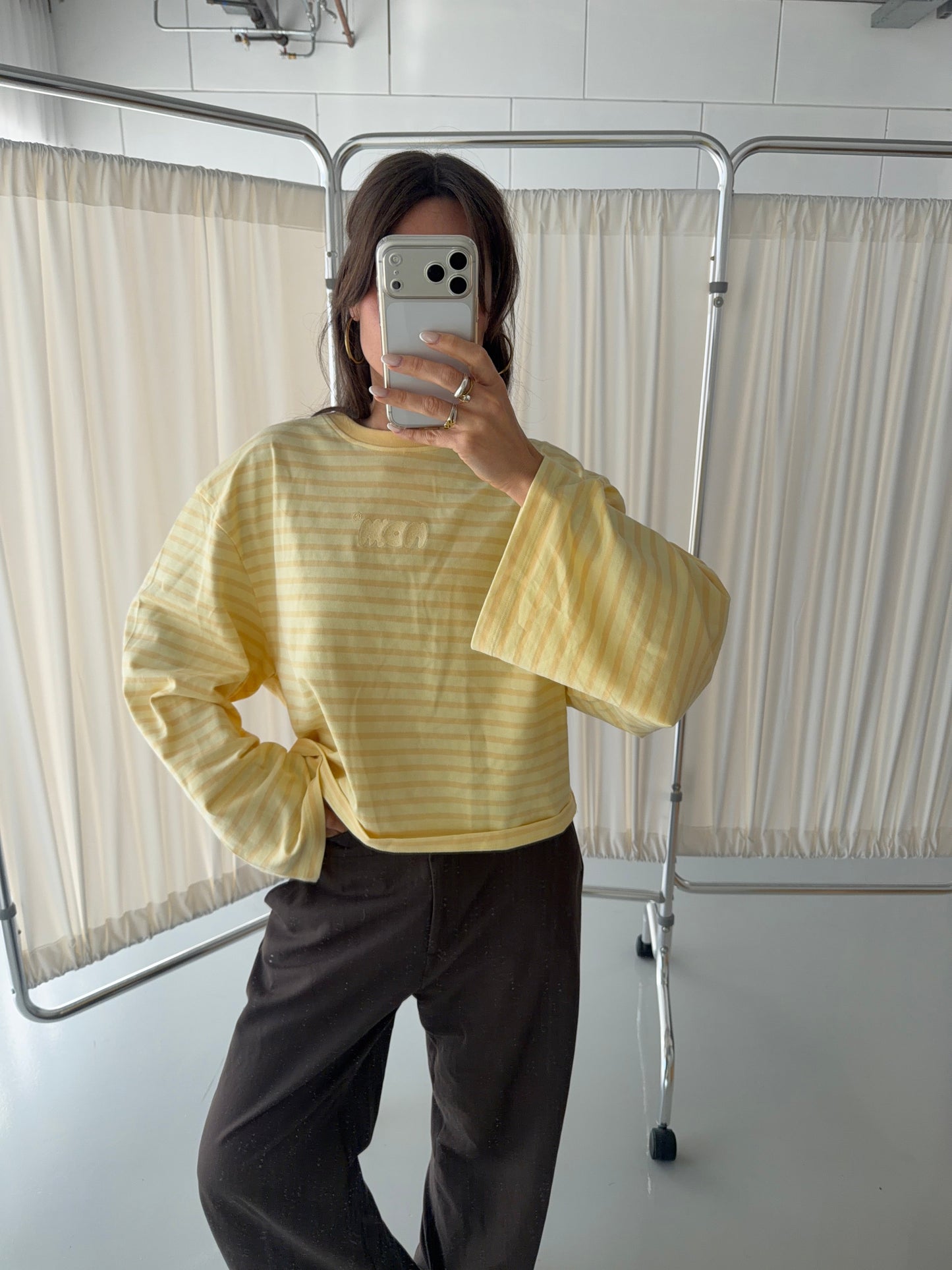 Model wearing size L oversized butter yellow striped long sleeve